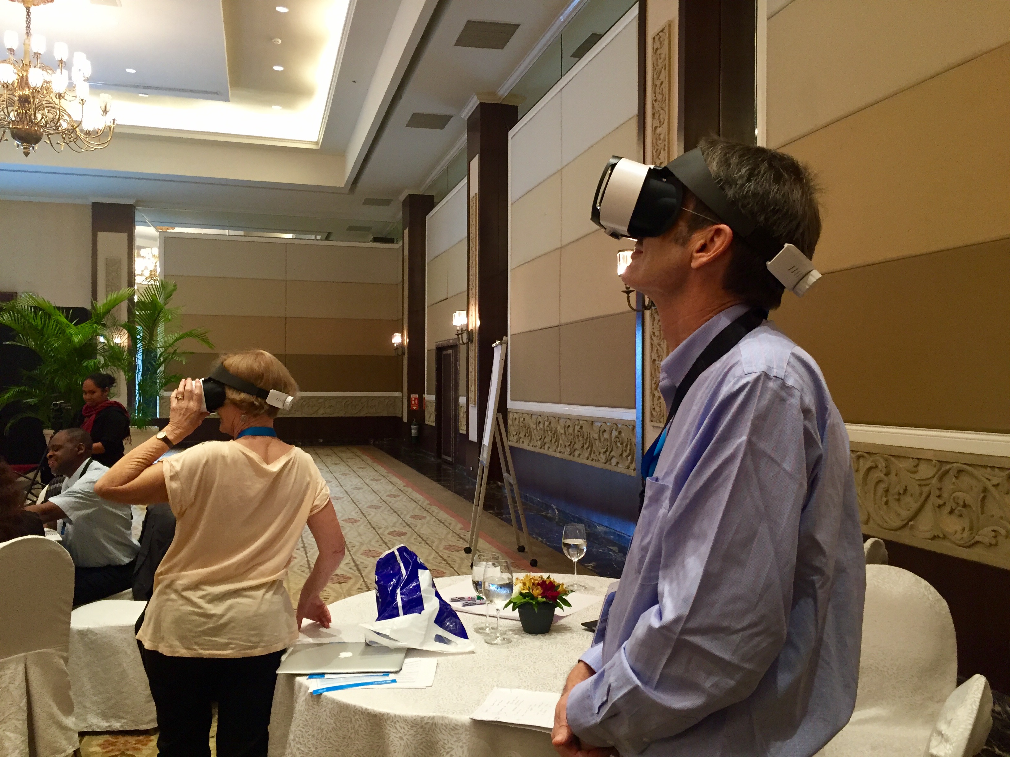 At the parenting support intervention workshop, participants try UNICEF China’s virtual reality devices which show the barefoot social worker and ECD center pilots