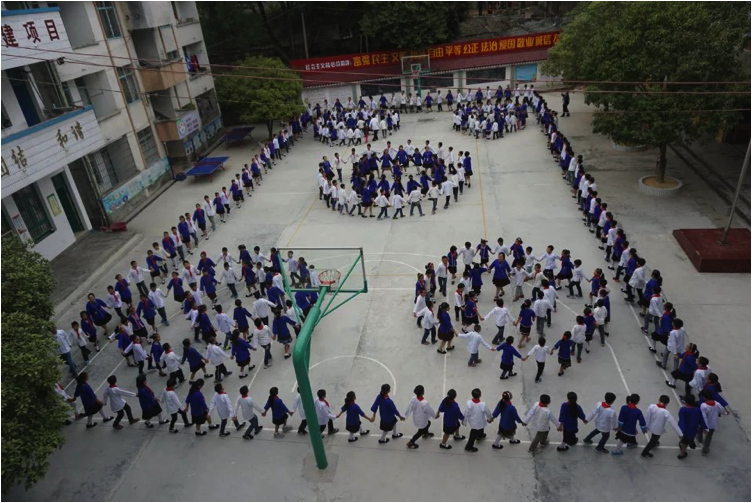 Figure 3：Performance by students and teachers at Bajiang Central Primary School, Sanjiang County